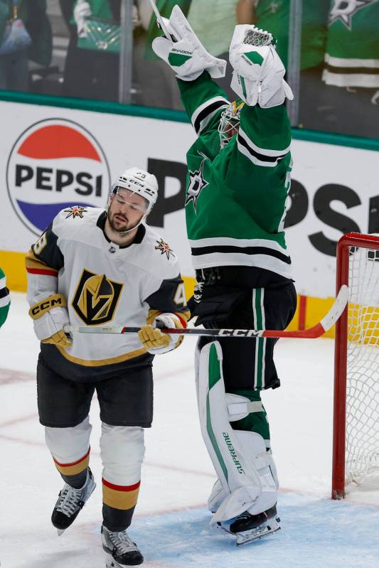 Vegas Golden Knights center Tomas Hertl, left, skates by as Dallas Stars goaltender Jake Oettin ...