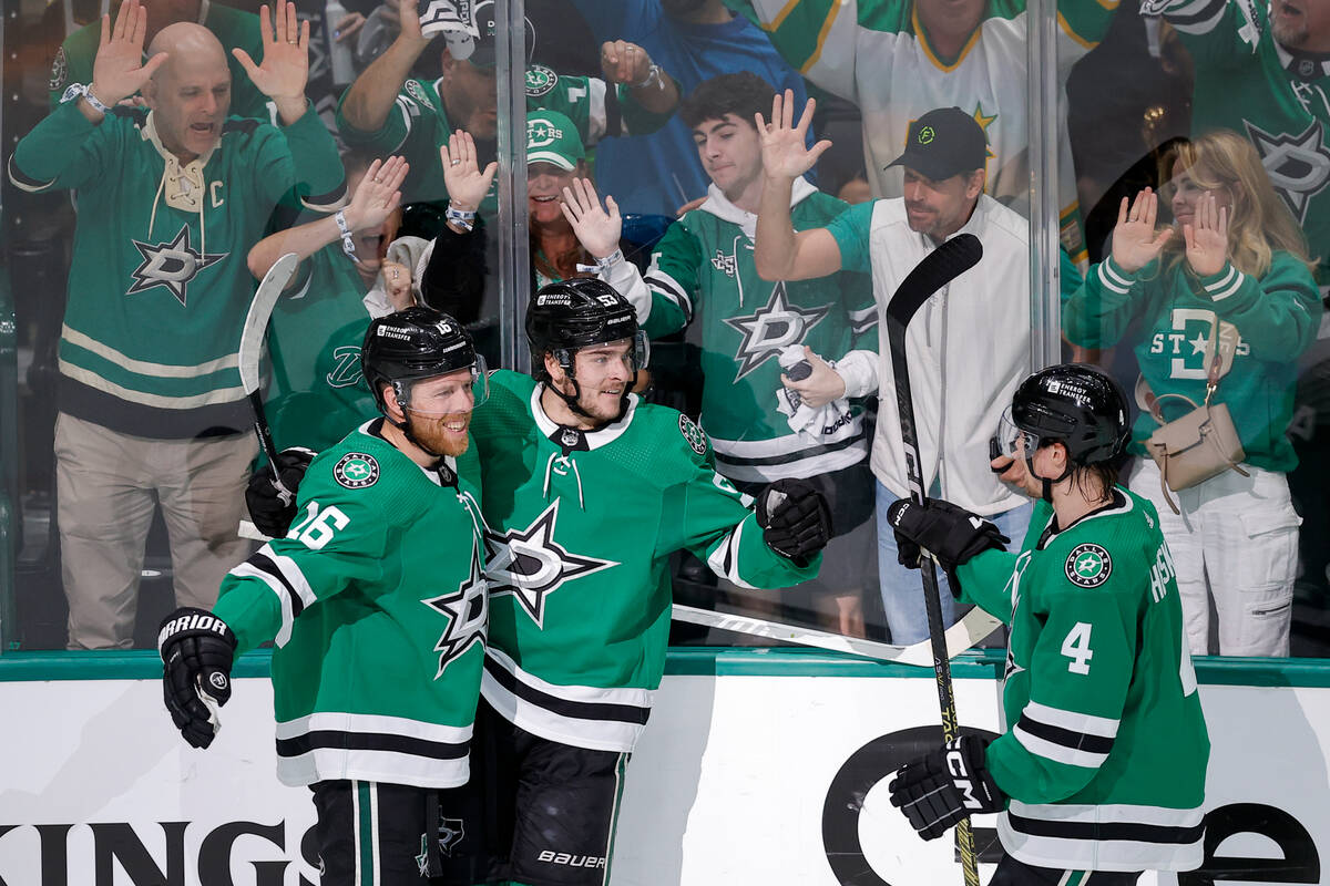 Dallas Stars center Wyatt Johnston, center, celebrates his first period goal with Joe Pavelski ...