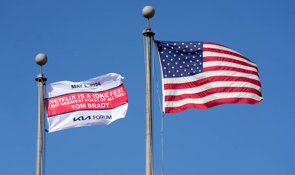 Flags fly outside the Kia Forum, the location of "The Greatest Roast of All Time: Tom Brad ...