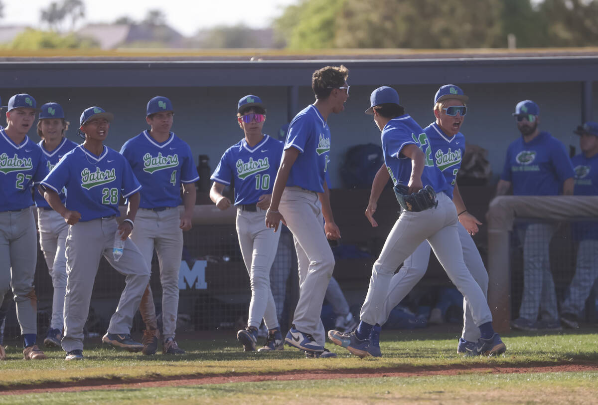 Green Valley players celebrate their lead between innings during a high school NIAA playoff bas ...