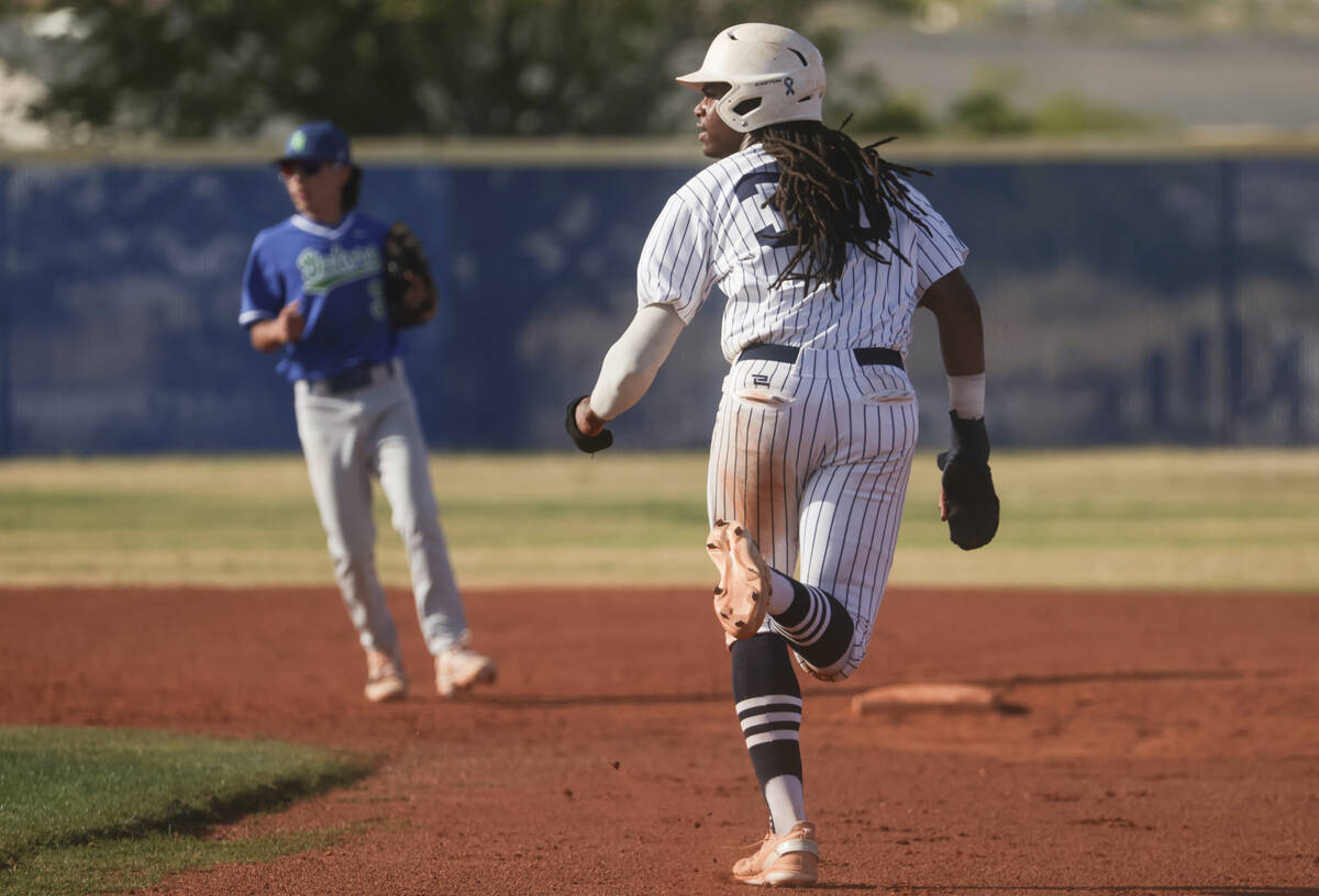 Shadow Ridge's Christian Wilkes (30) runs to second base against Green Valley during a high sch ...