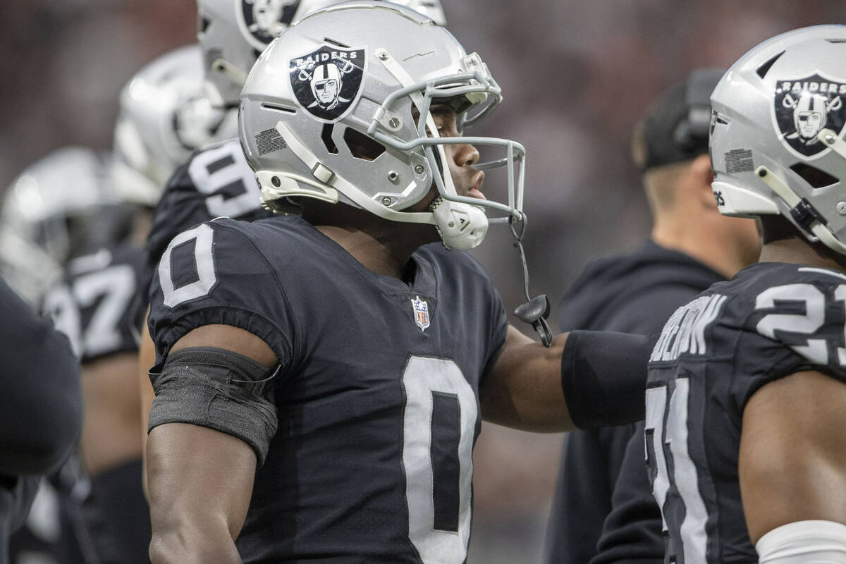 Raiders cornerback Jakorian Bennett (0) calls out to the team taking the field during the first ...