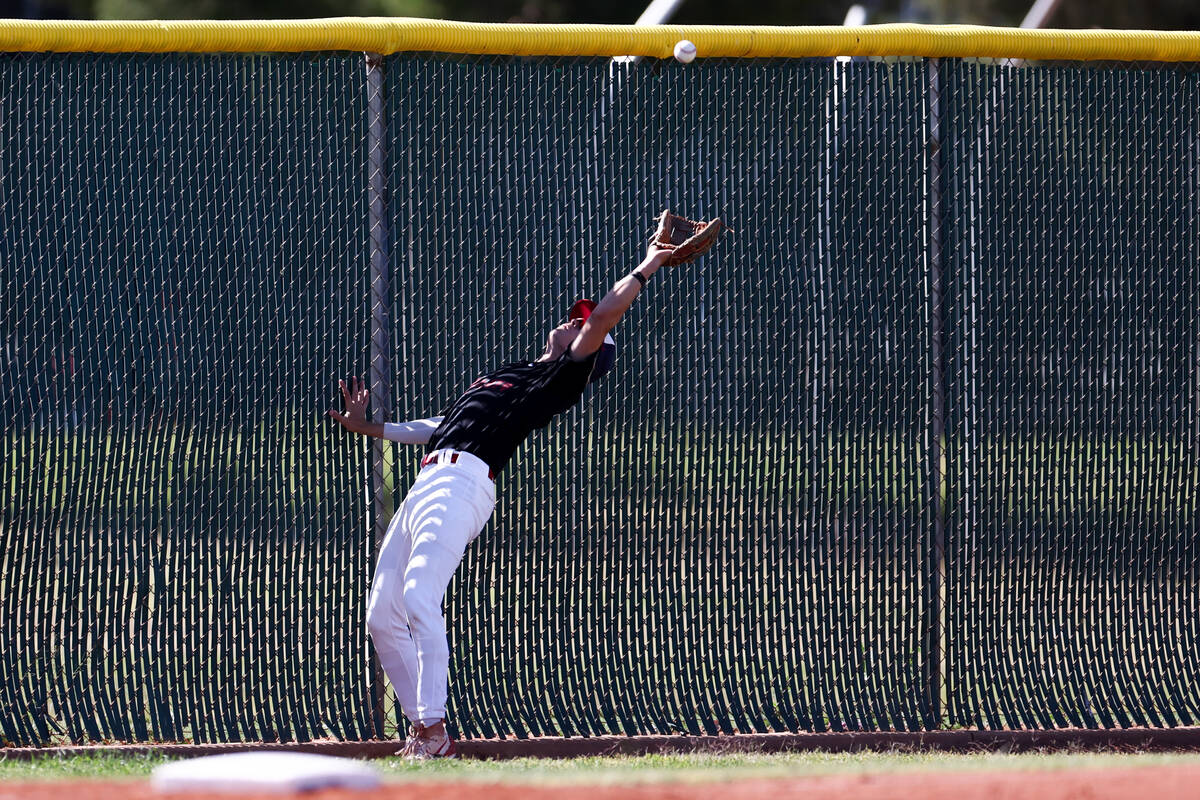 Liberty's Konner Brown (7) bends to catch for an out on Las Vegas during a Class 5A high school ...