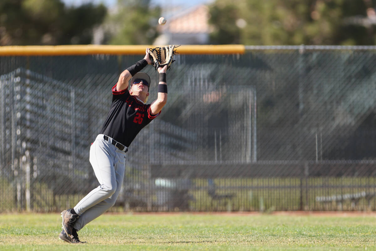 Las Vegas outfielder Justin Romero (26) prepares to catch during a Class 5A high school basebal ...