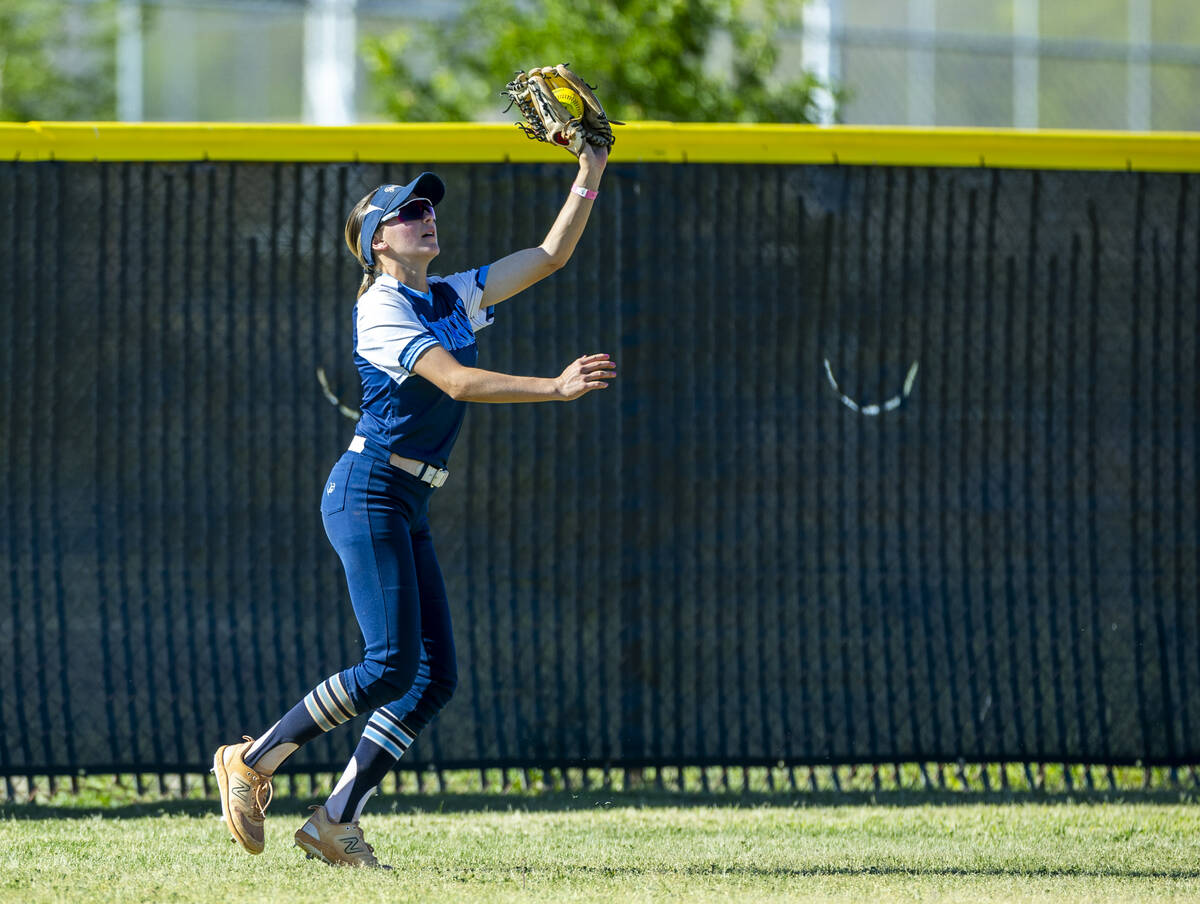 Centennial outfielder Ashley Madonia (3) grabs a long fly ball from a Palo Verde batter during ...