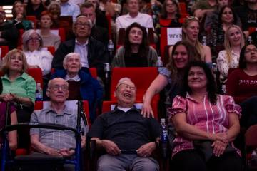 George Lee, center, the focus of documentary “Ten Times Better,” reacts at the en ...