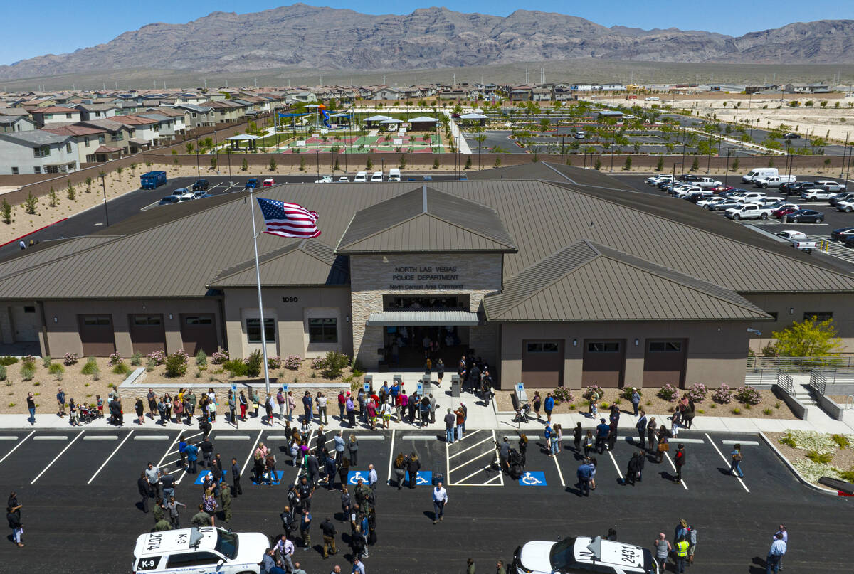 People attend the official opening ceremony and ribbon cutting for the third North Las Vegas po ...