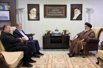 Hezbollah leader Sayyed Hassan Nasrallah, right, meets with Ziad al-Nakhleh, the head of Palest ...