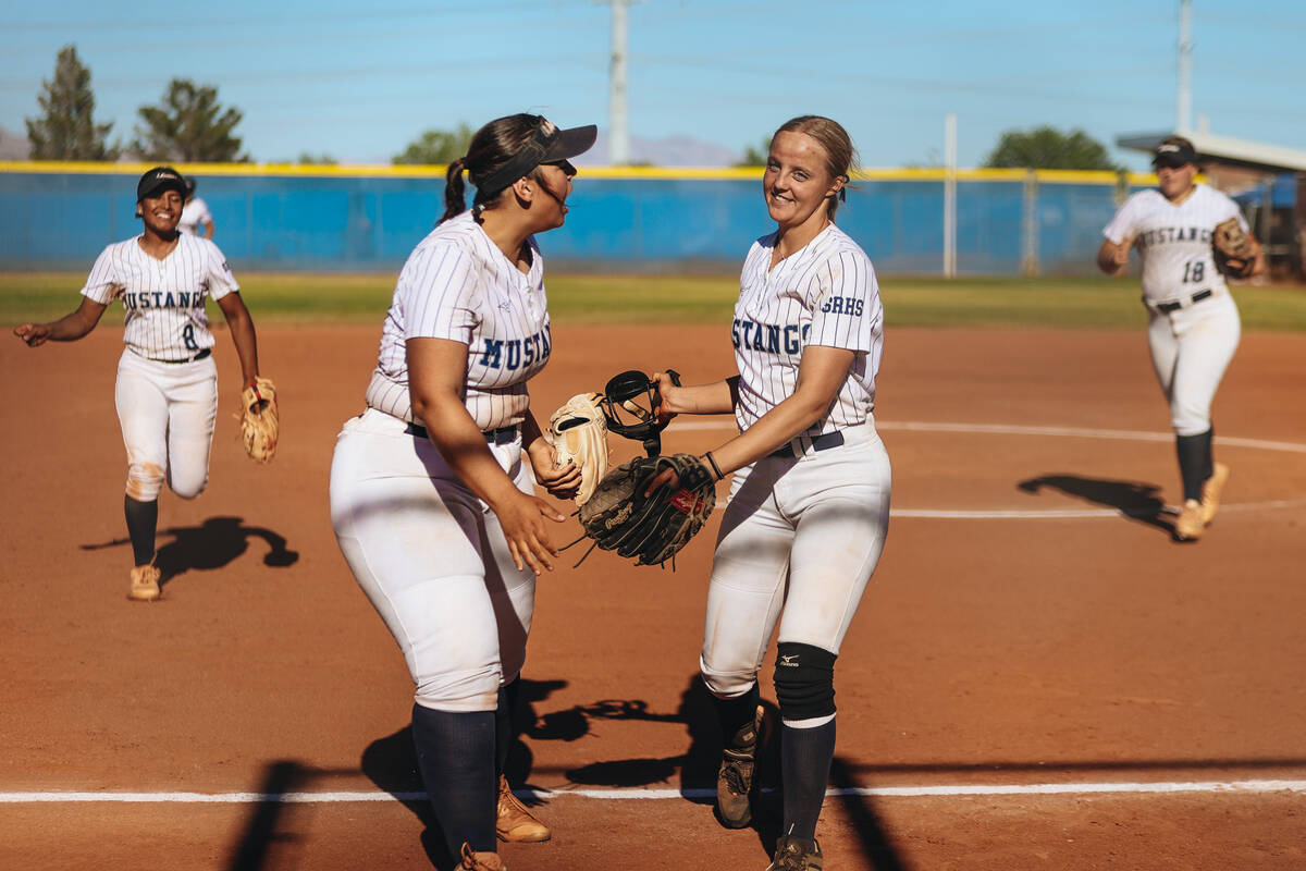 Shadow Ridge’s Abby Covington (10) and and Josslin Law (4) celebrate at the end of an in ...