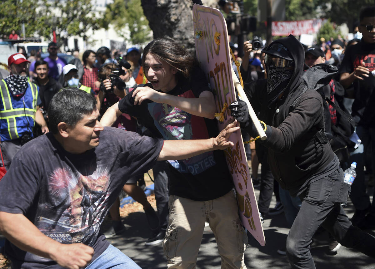 In this Aug. 27, 2017, file photo, demonstrators clash during a free speech rally in Berkeley, ...