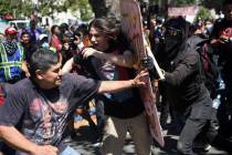 In this Aug. 27, 2017, file photo, demonstrators clash during a free speech rally in Berkeley, ...