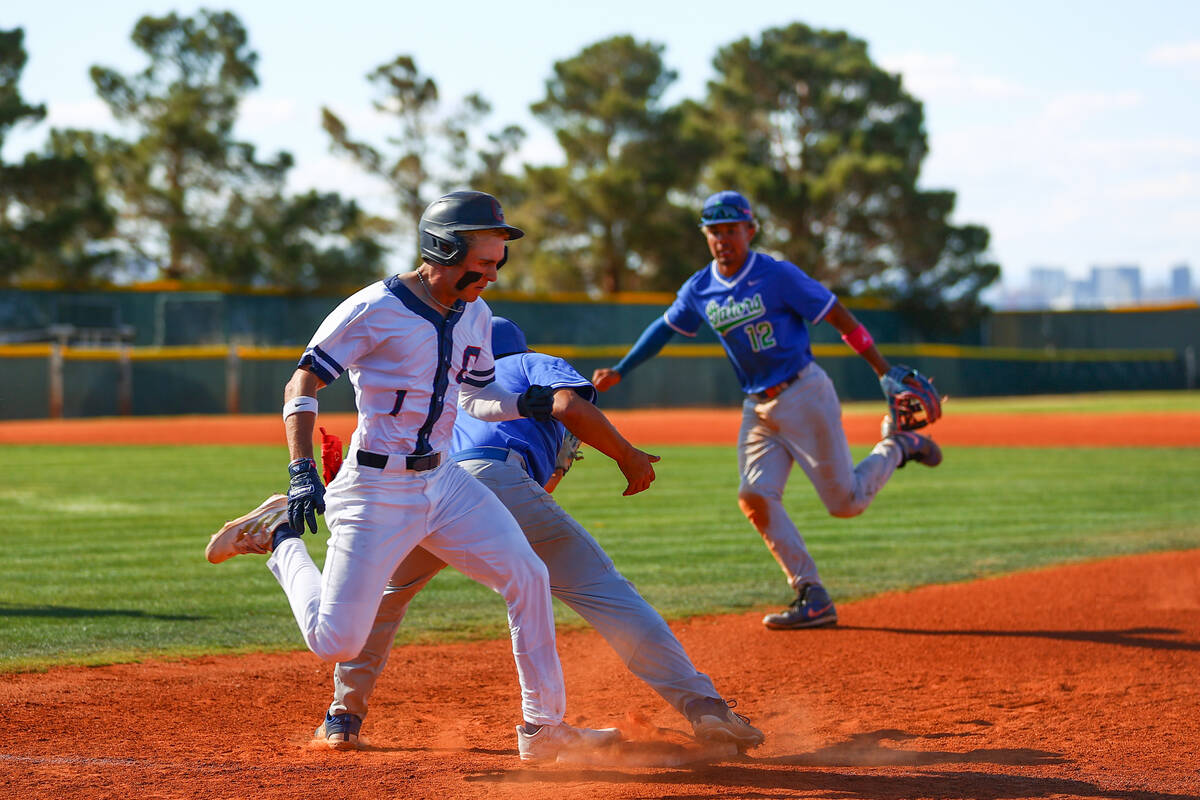 Coronado pitcher Evan Festa (1) safely reaches first base while Green Valley first baseman Brid ...