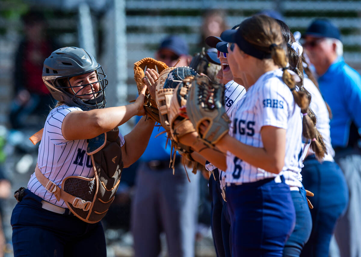 Shadow Ridge catcher Jacobi Gledhill (13) greets teammates as they ready to face Coronado in th ...