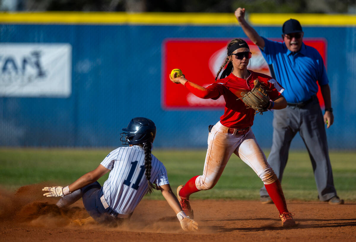 Shadow Ridge runner Alina Pavlovich (11) slides late into second base as Coronado infielder Bai ...