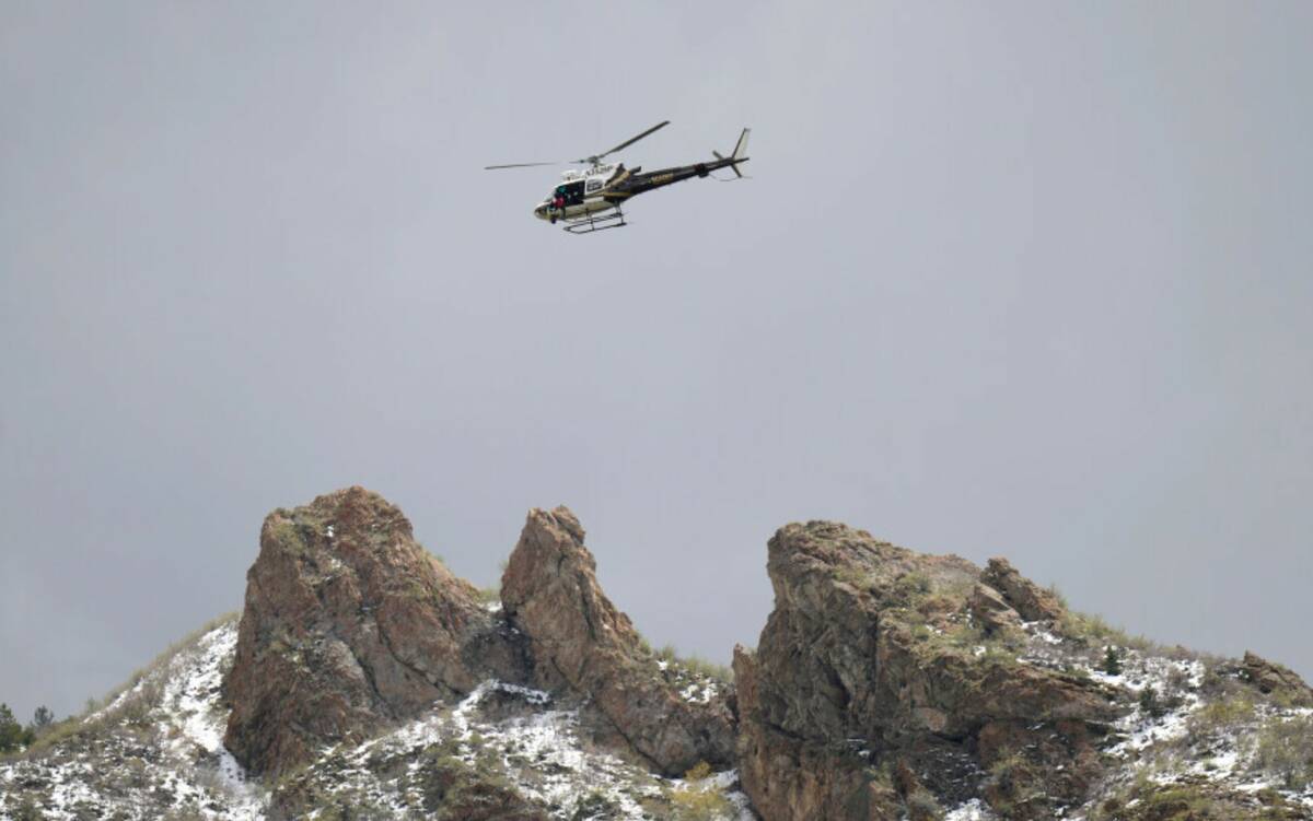 A Utah Department of Public Safety helicopter carries rescuers from Hidden Valley Park, Thursda ...