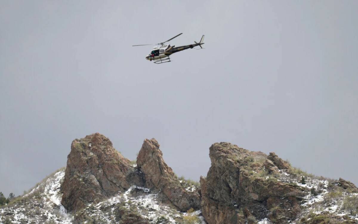 A Utah Department of Public Safety helicopter carries rescuers from Hidden Valley Park, Thursda ...