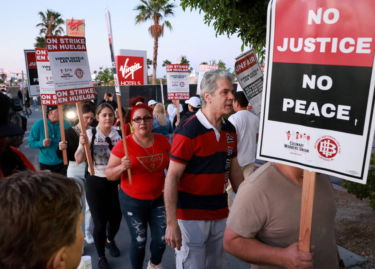 Culinary Local 226 members walk the picket line at the start of a 48 hour strike at Virgin Hote ...