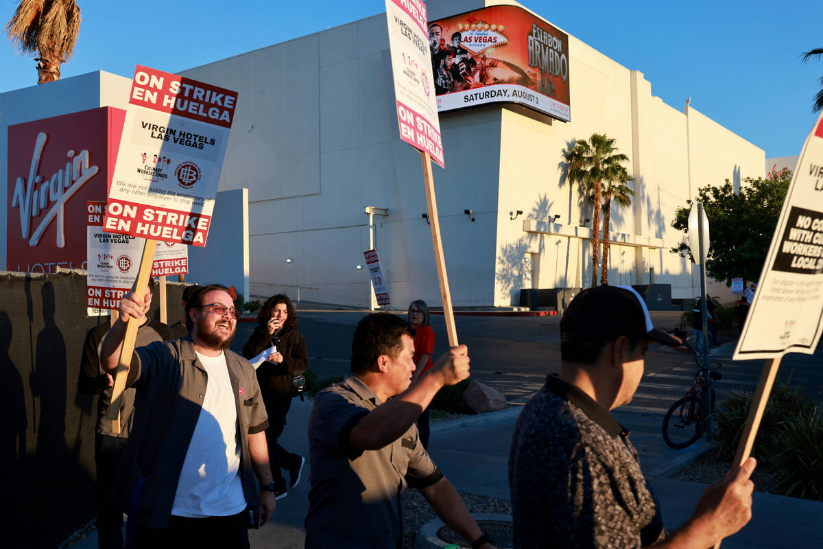 Culinary Local 226 members walk the picket line at the start of a 48 hour strike at Virgin Hote ...