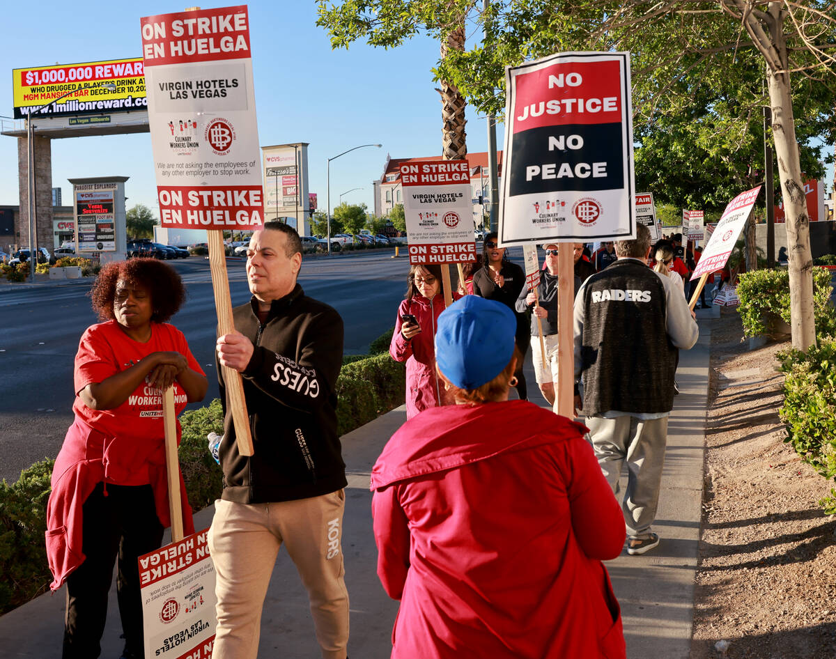 Culinary Local 226 members walk the picket line at the start of a 48 hour strike at Virgin Hote ...