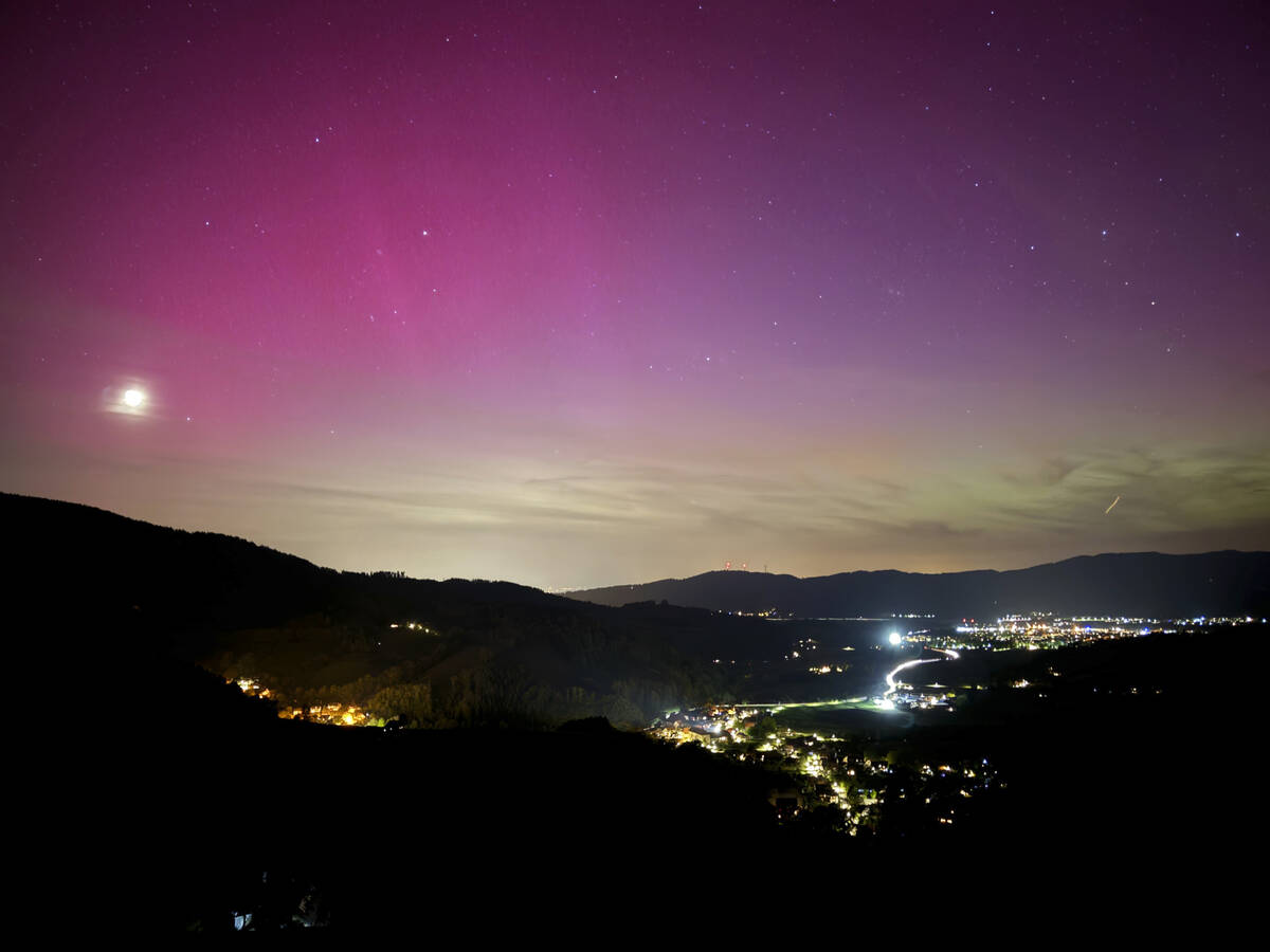 Northern lights appear over the Dreisamtal valley in the Black Forest near Freiburg, Germany, F ...