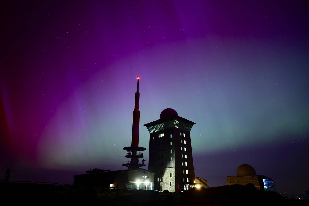 Northern lights appear in the night sky above the Brocken early Saturday, May 11, 2024, in Schi ...
