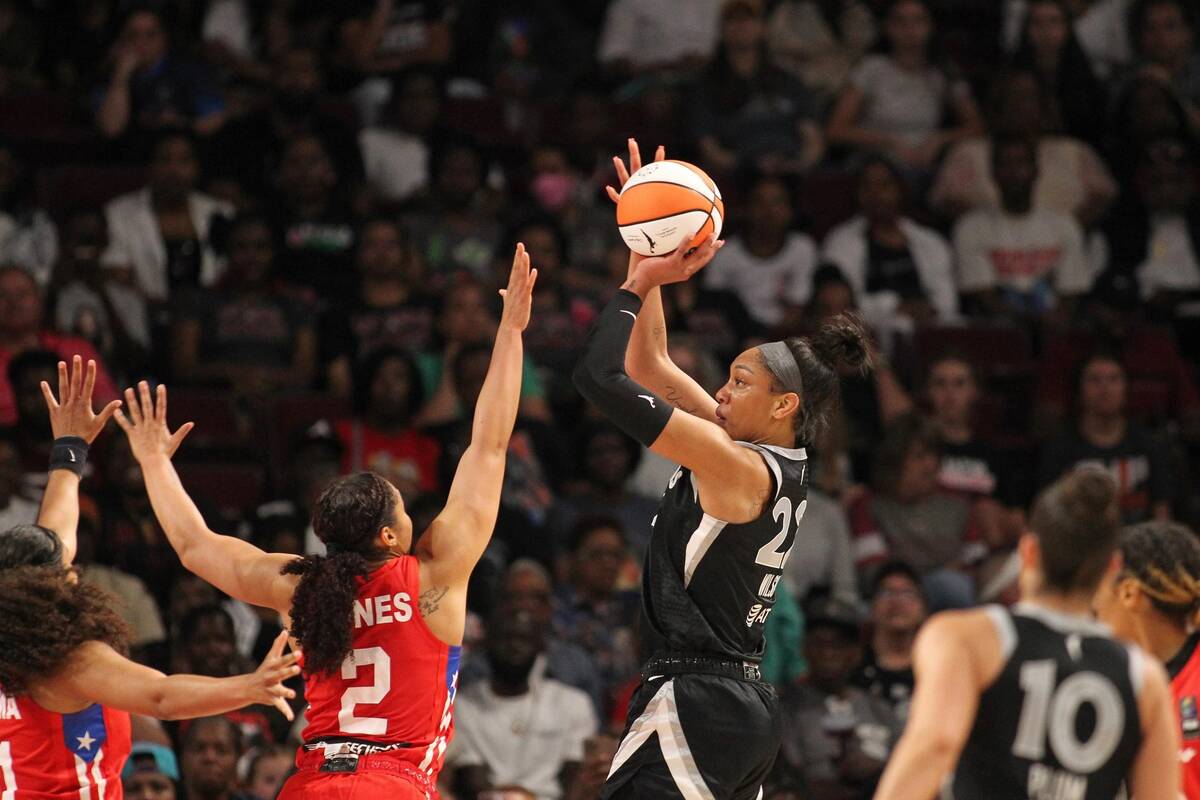 Aces forward A'ja Wilson goes up for a shot over Brianna Jones during a preseason game against ...