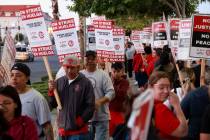 Culinary Local 226 members walk the picket line at the start of a 48 hour strike at Virgin Hote ...