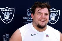 Raiders rookie guard Jackson Powers-Johnson smiles as he addresses the media after rookies firs ...