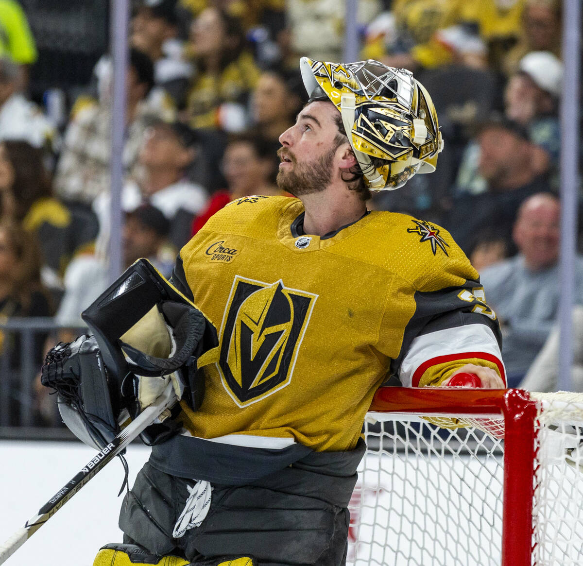 Golden Knights goaltender Logan Thompson (36) watches a replay against the Dallas Stars during ...