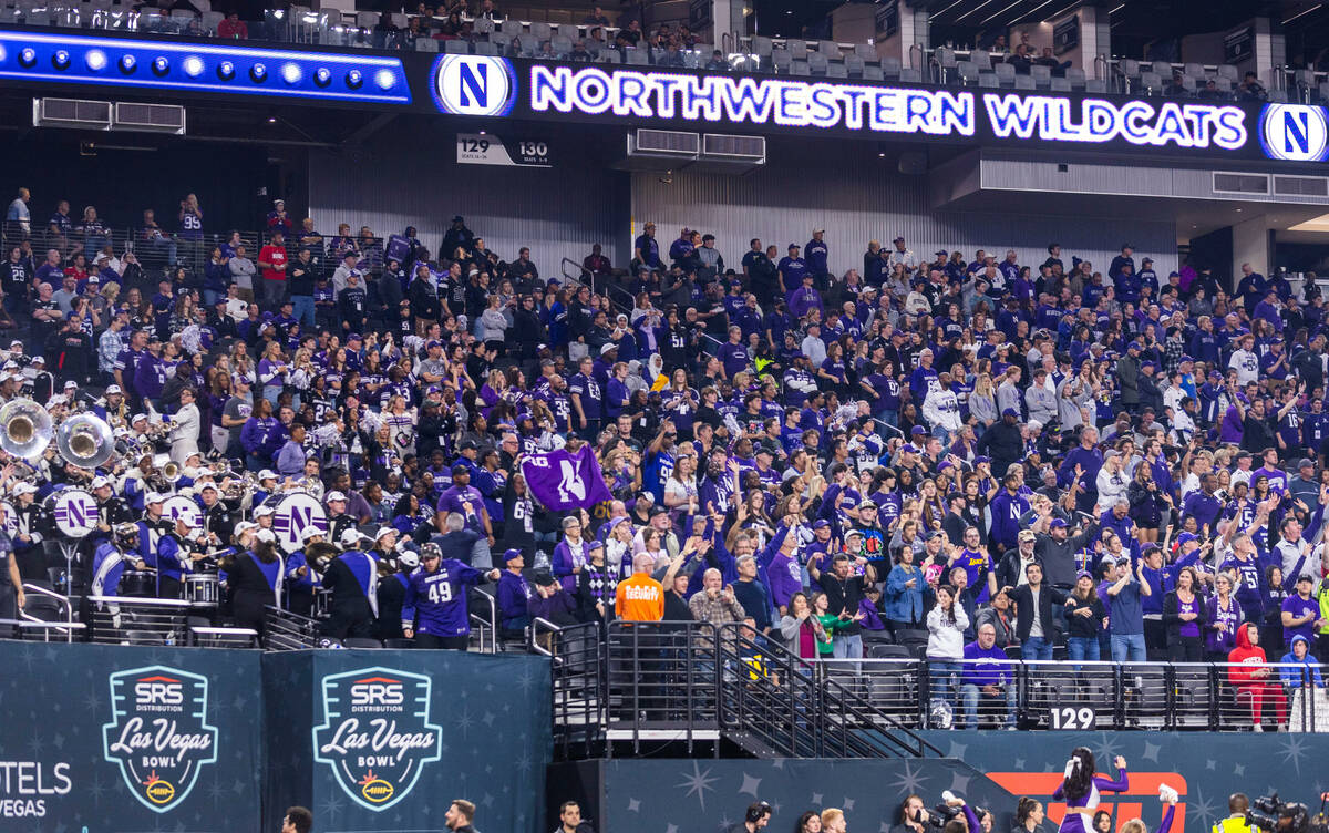 Northwestern Wildcats fans cheer on their team against the Utah Utes during the second half of ...
