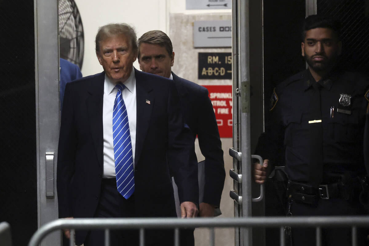 Former President Donald Trump returns from a break during his trial at Manhattan criminal court ...