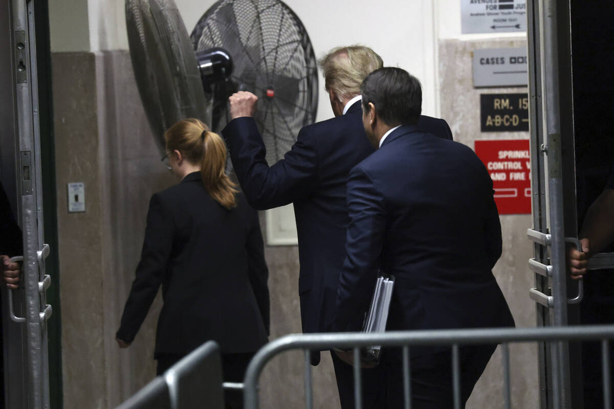 Former President Donald Trump leaves for a break during his trial at Manhattan criminal court, ...