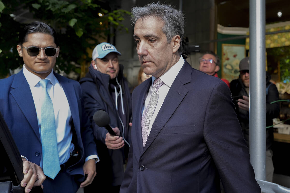 Michael Cohen leaves his apartment building on his way to Manhattan criminal court, Monday, May ...