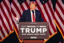 Former President Donald Trump speaks to a crowd at a caucus night watch party hosted by the Tru ...