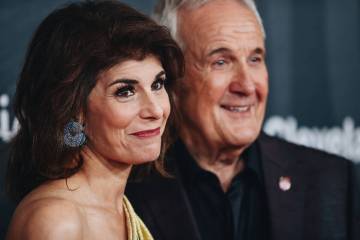 Camille Ruvo, left, poses with her husband, Larry Ruvo, for photographs on the red carpet at th ...