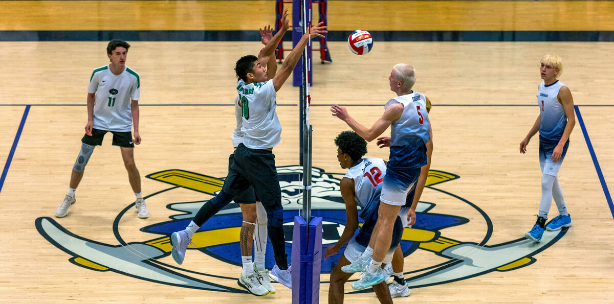 Palo Verde's Dylan Ho (10) sends a shot past Coronado's Dexter Brimhall (5) and Jayden Bell (12 ...