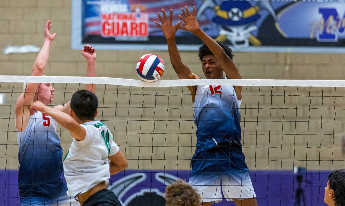 Coronado's Dexter Brimhall (5) and Jayden Bell (12) block a hit by Palo Verde's Dylan Ho (10) d ...