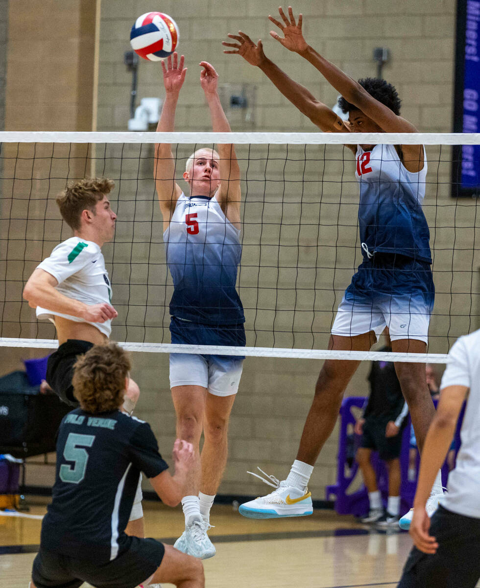 Coronado's Dexter Brimhall (5) and Jayden Bell (12) block a hit by Palo Verde during the Class ...