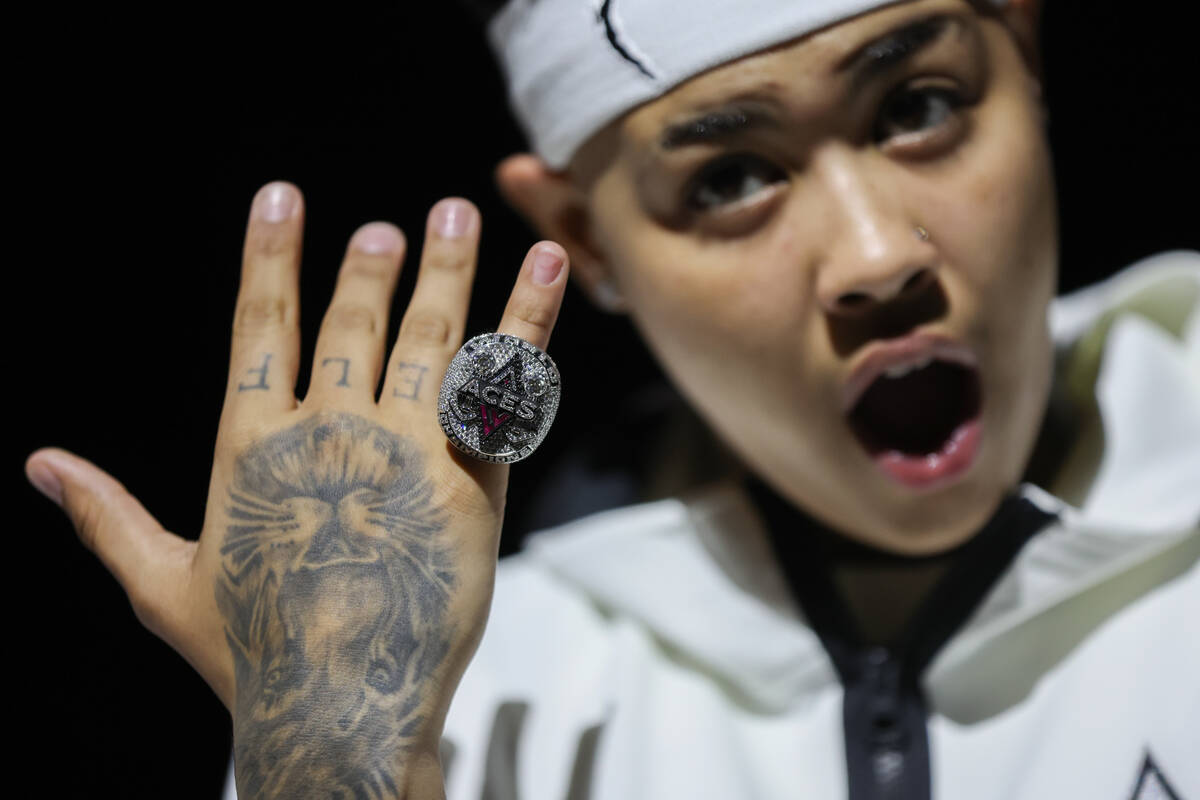 Las Vegas Aces guard Kierstan Bell shows off her new 2023 WNBA Championship ring before a WNBA ...