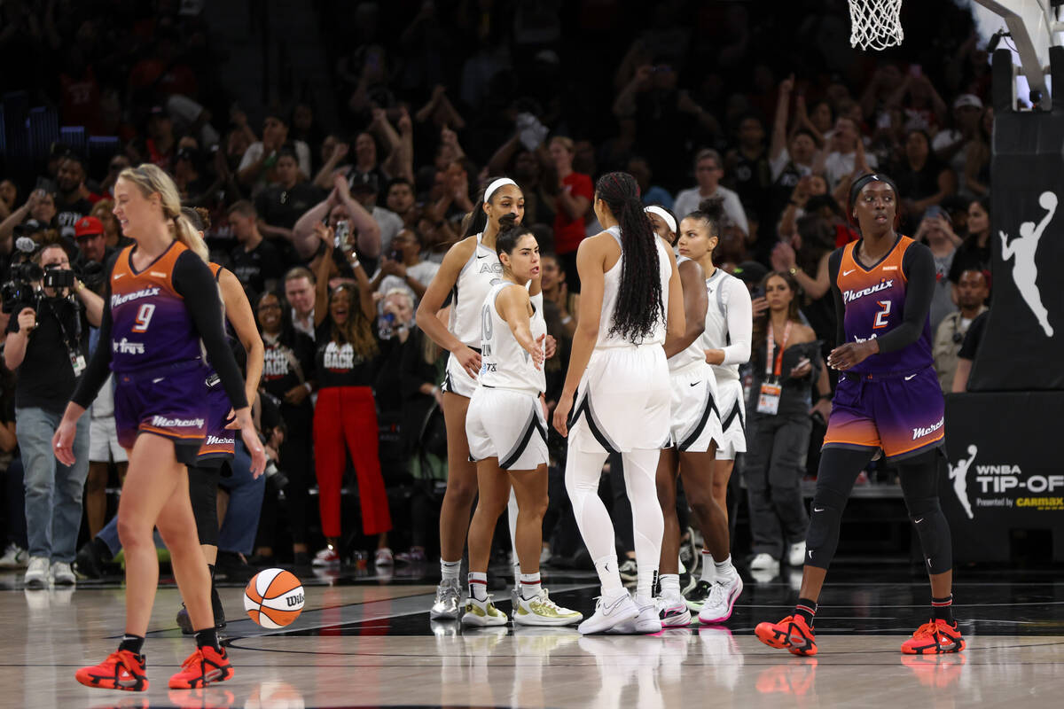 The Las Vegas Aces gather after beating the Phoenix Mercury in a WNBA basketball game at Michel ...