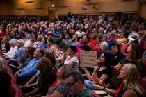 Residents of the Lone Mountain area, in the foreground, who are opposed to a proposed new Churc ...