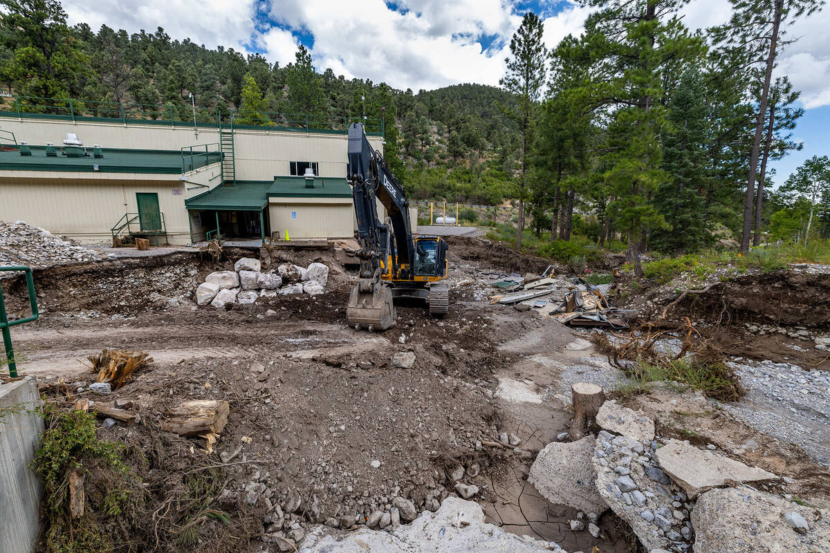Boulders are maneuvered into place at Lundy Elementary School on Aug. 25, 2023, at Mount Charle ...