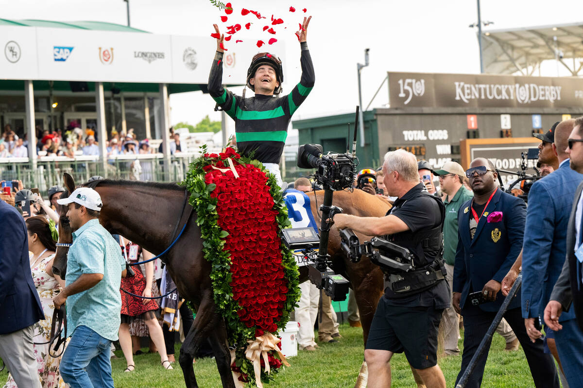 Jockey Brian Hernandez, Jr., on Mystik Dan, celebrates after winning the 150th running of the K ...