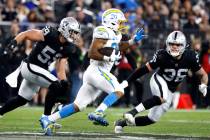 Raiders linebacker Luke Masterson (59) and linebacker Curtis Bolton (36) chase Los Angeles Char ...