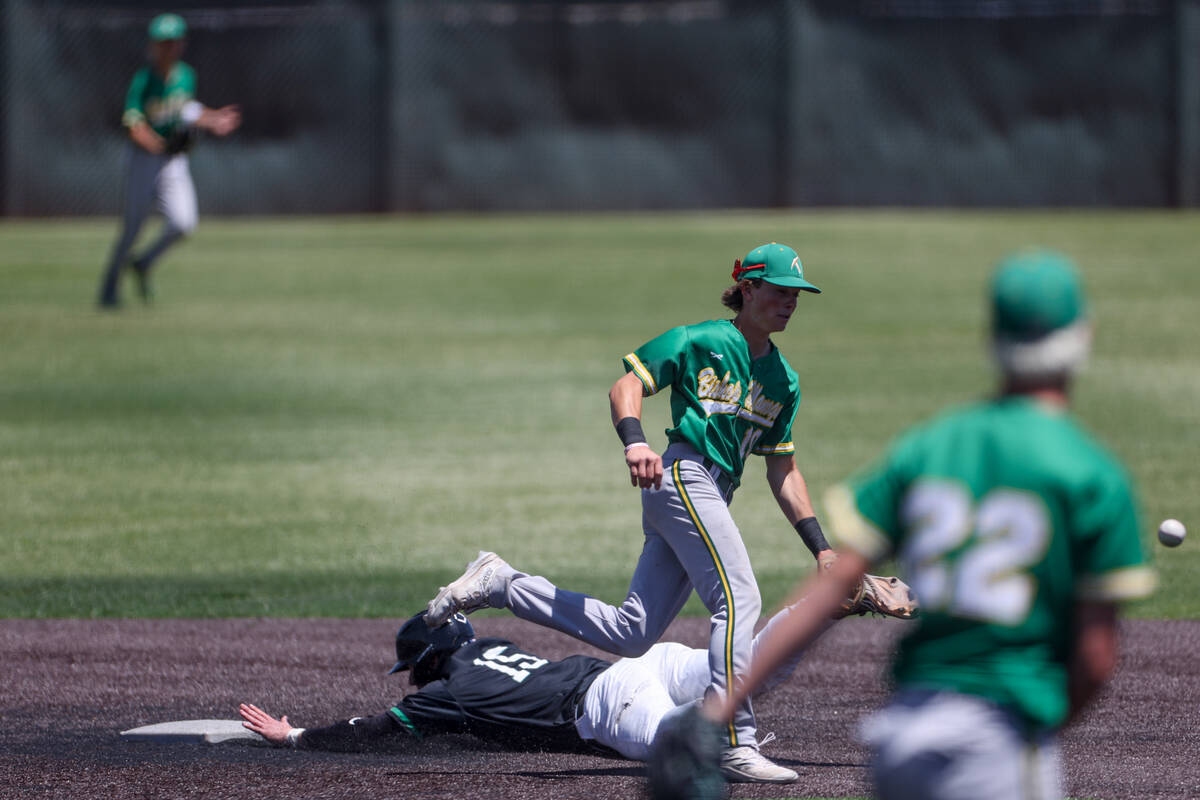 Palo Verde infielder Andrew Kaplan (15) slides safely into second base after Bishop Manogue sho ...