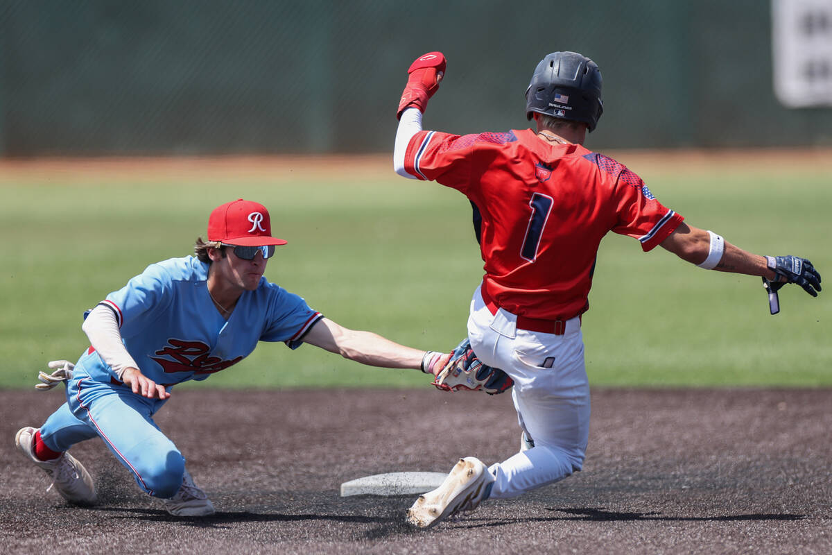Reno infielder Harvey Smerdon, left, tags out Coronado pitcher Evan Festa (1) during a Class 5A ...