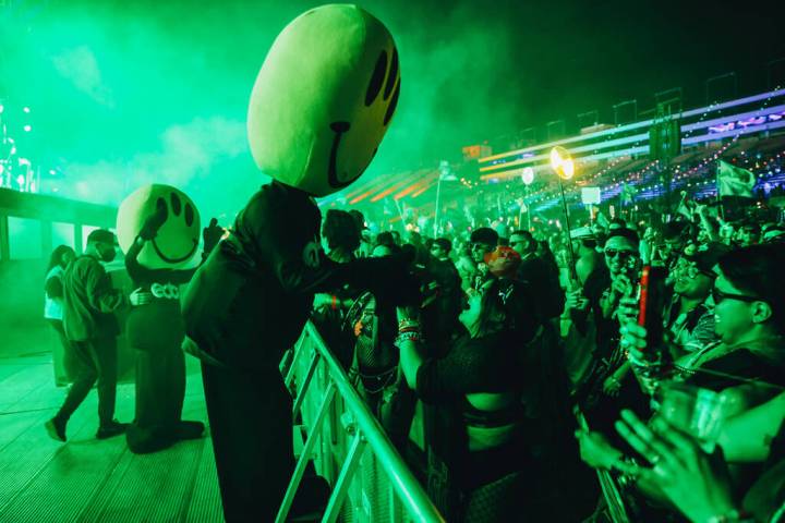 A costumed performer interacts with the crowd during the second day of the Electric Daisy Carni ...