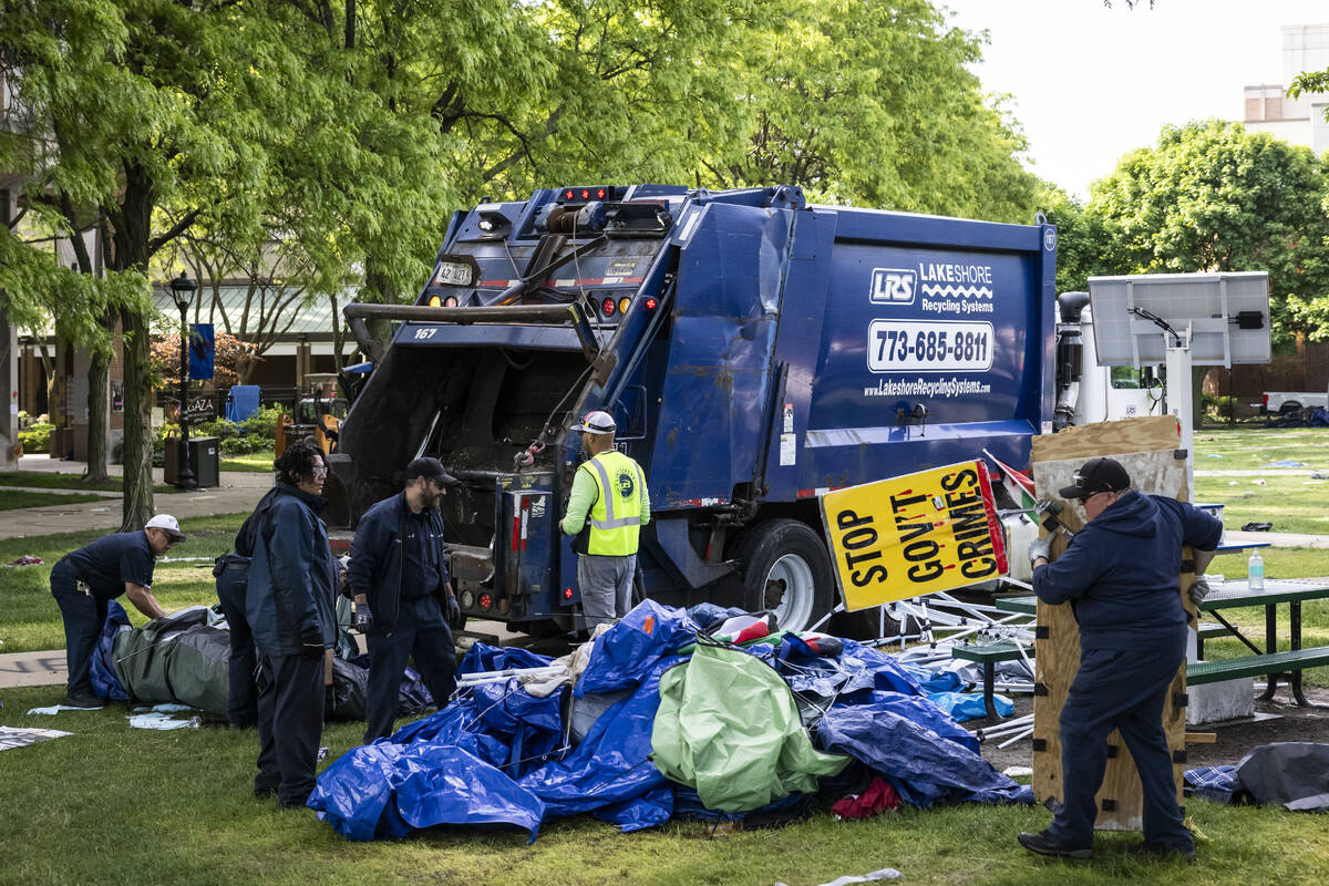 Crews disassemble the pro-Palestinian protest encampment in the quad at DePaul University's Lin ...