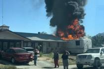 Crews battle a mobile home fire Thursday, May 16, 2024, on the 5400 block of Ferrari Avenue in ...