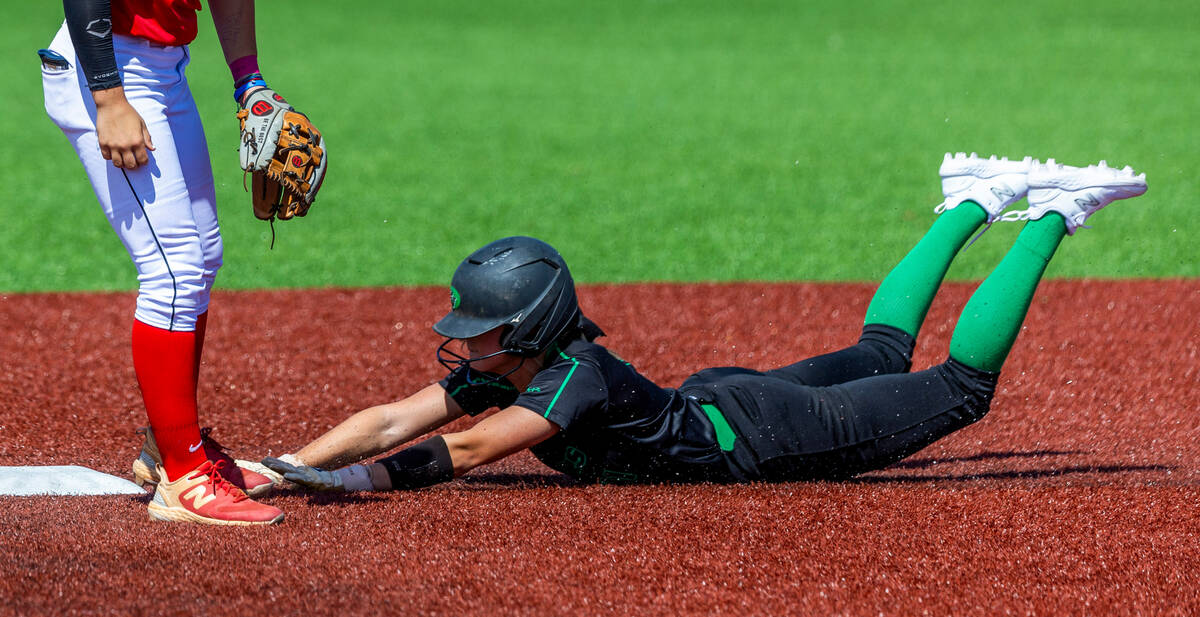 Palo Verde runner Taylor Johns (11) slides in safe at second base against Coronado infielder Ba ...